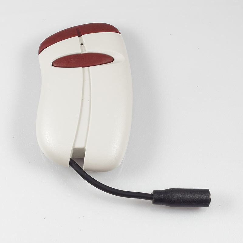 Open Sesame E.C.U. transmitter with a cable and plug