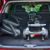 Golden Buzzaround CarryOn HD folded in an SUV cargo area