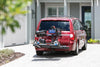 Red minivan carrying a scooter on a Harmar AL300 (base model shown)