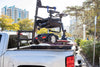 Scooter stowed in a pickup truck bed under the boom of a Harmar AL815CC (base model shown)