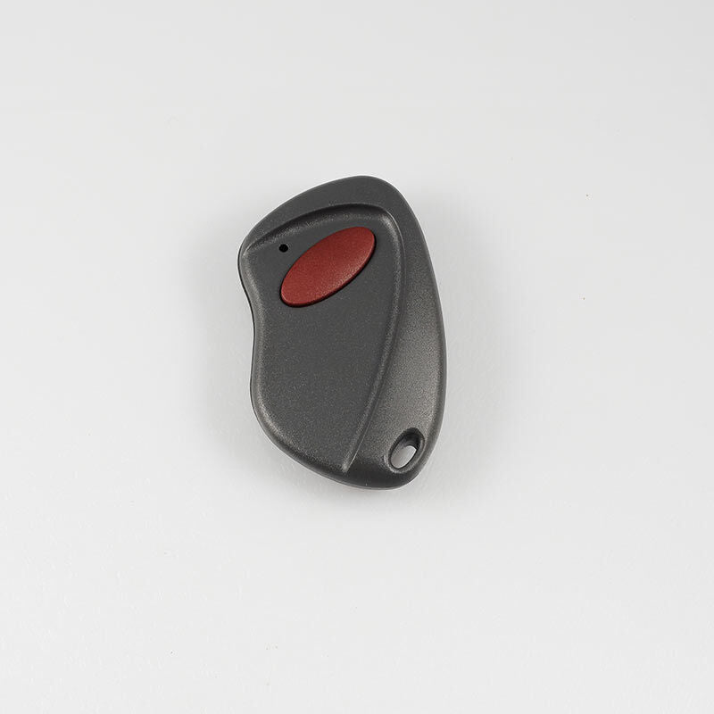 Open Sesame keychain transmitter, dark gray with a red button