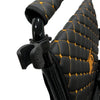 ComfyGO cane holder clamped to a wheelchair frame, holding a cane