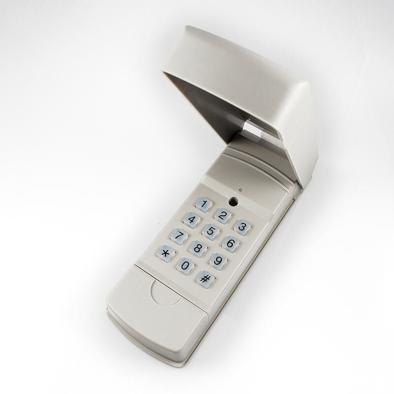 Open Sesame keyless entry keypad with its flip-up cover open