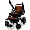 ComfyGO Majestic IQ-7000 folding power wheelchair with a black frame and tan upholstery