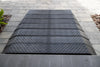 Rubber threshold ramp sections joined on pavers