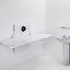 Smirthwaite wall-mounted shower stretcher, folded down in a bathroom