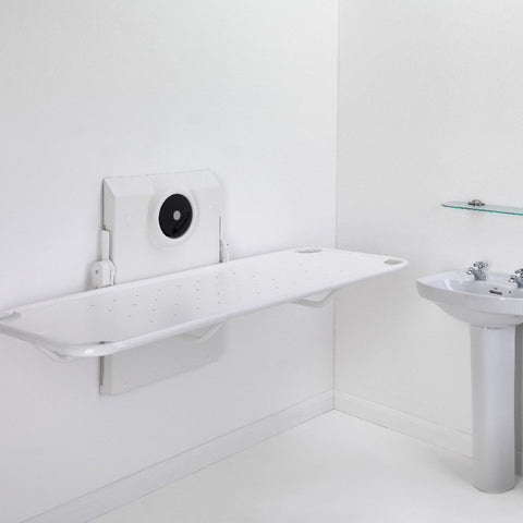 Smirthwaite wall-mounted shower stretcher, folded down in a bathroom