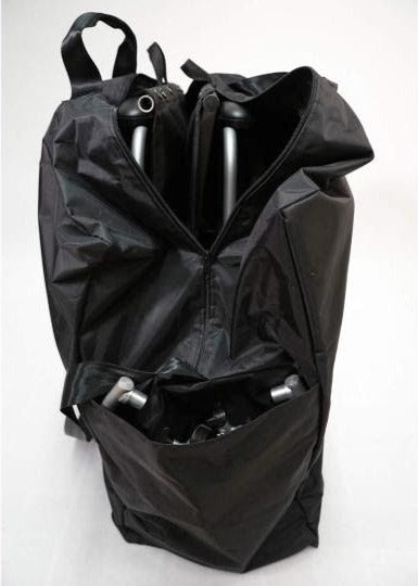 Black carry bag unzipped, with a folded wheelchair frame inside