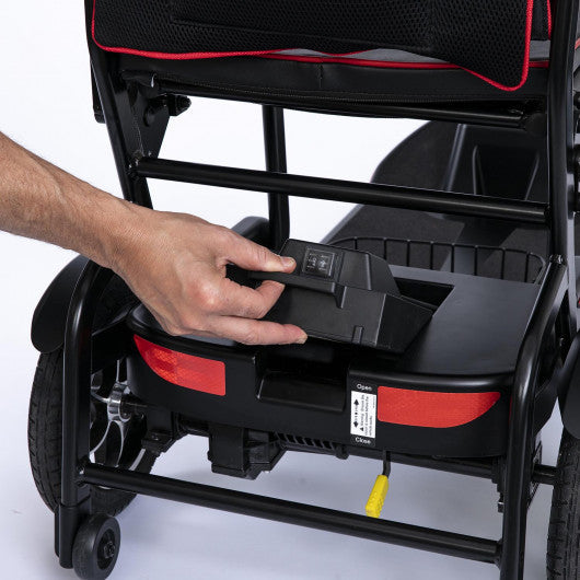 Hand placing the battery box into the base of a Feather scooter
