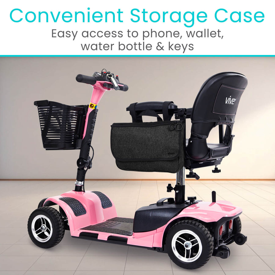 Black Vive mobility side bag hanging from the seat of a pink mobility scooter
