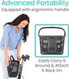 Woman lifting a black Vive basket off the front of a scooter by its handle