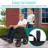 Man in a transport wheelchair with a black Vive side bag on the armrest, a woman standing behind him
