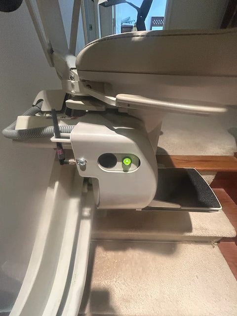Bruno curved stairlift carriage on its rail at a turn, close up from above