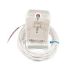 White plug-in transformer resting on a coil of white low-voltage wiring