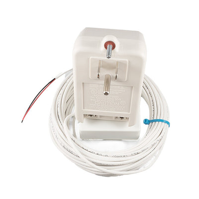 White plug-in transformer resting on a coil of white low-voltage wiring