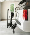 Bruno Out-Sider lift carrying a folded power wheelchair on the back of an SUV in a garage