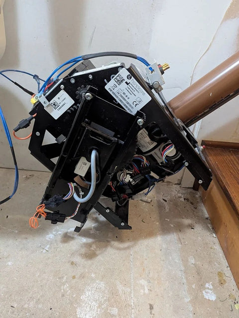 Handicare stairlift carriage removed from its curved rail during a repair