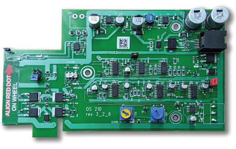 Green circuit board marked OS 210, with an orange alignment tag along its left edge