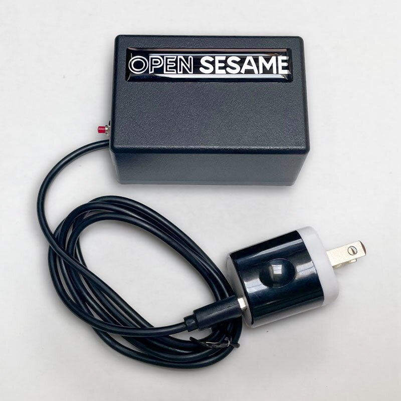 Open Sesame voice interface box with its power adapter and cable